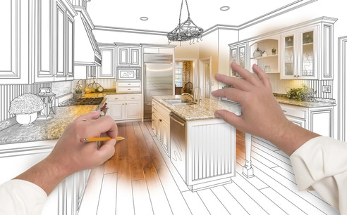 Picture showing hands designing a kitchen remodel.